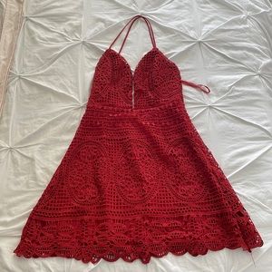 Formal red mini dress with embroidery.